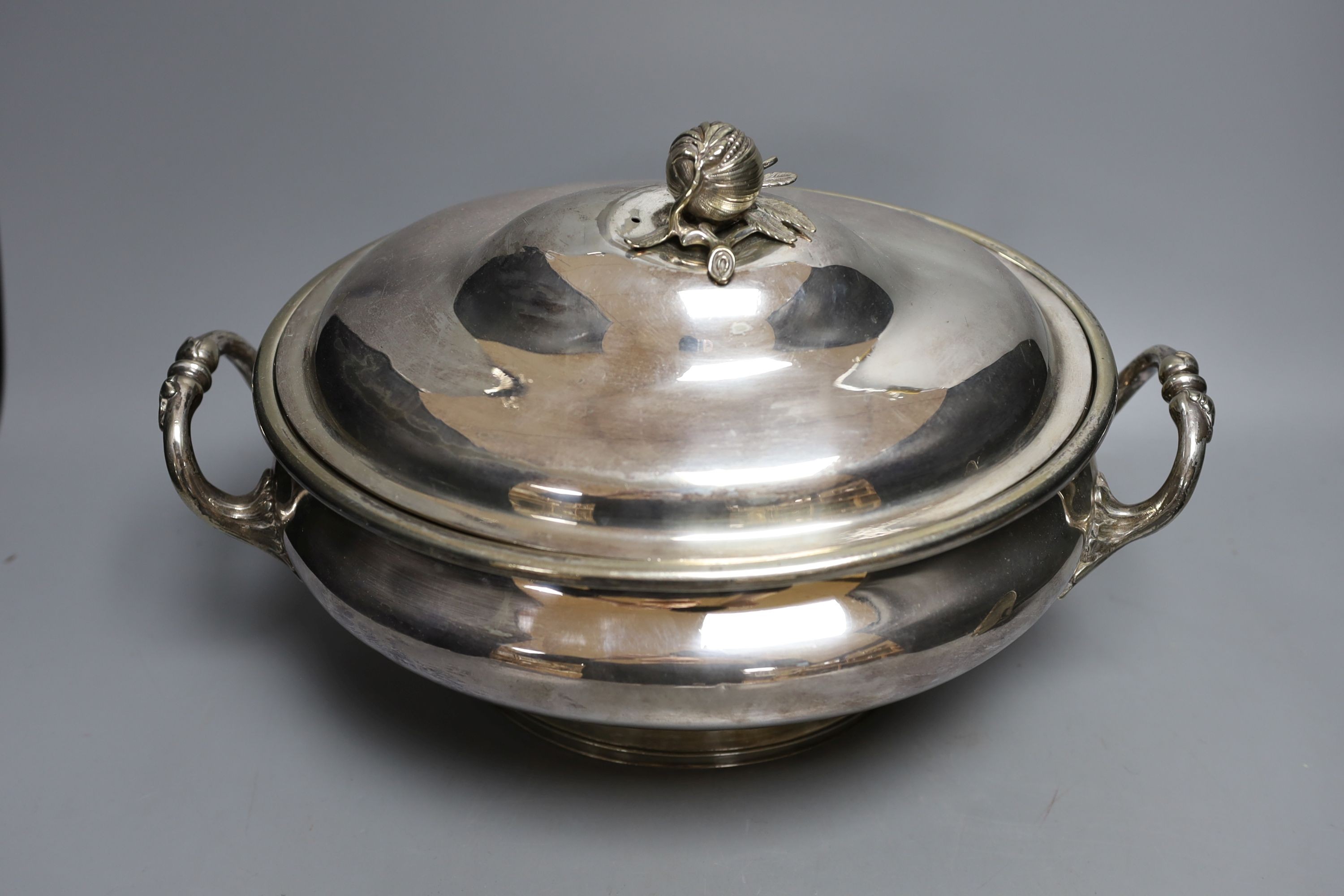 A plated oval two handled soup tureen and cover and a plated coffee pot, tureen, 39 cms wide.